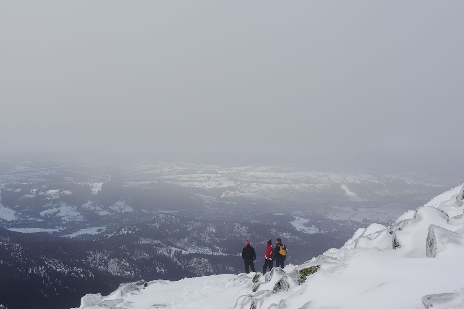 Hikers Climbing Down The Mountain