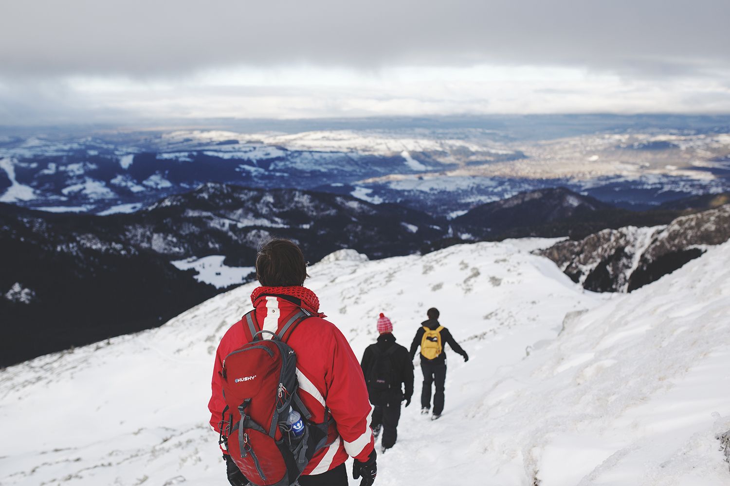 Hikers Climbing Down The Mountain