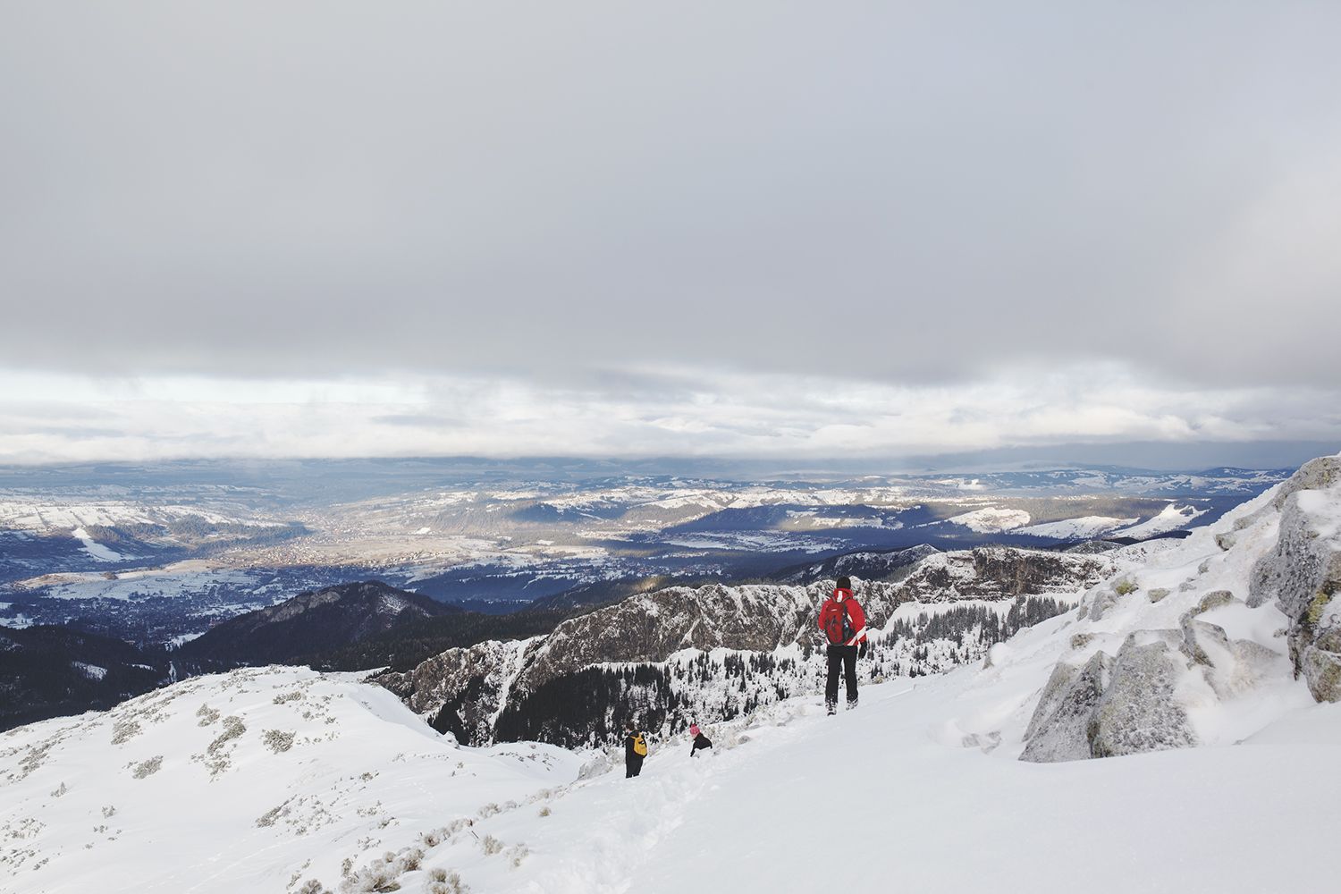 Hikers Climbing Down The Mountain