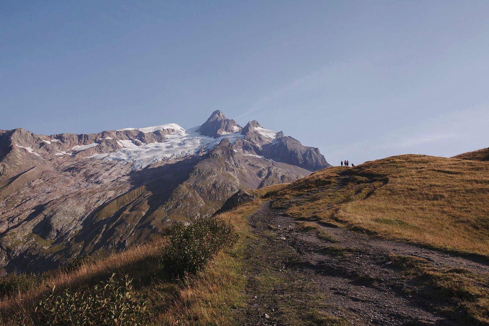 Hikers Climbing Towards The Mountain Pass