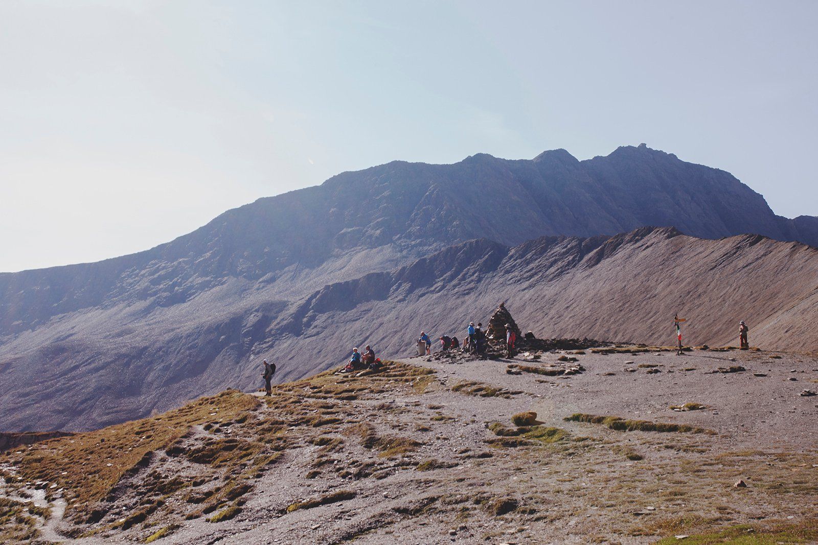 Bunch Of People Resting At The Top Of Mountain Pass