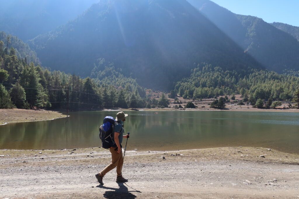 On the Annapurna Trail near the lake a hiker hikes